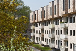 Swoim wyglądem fasada współgra obecnie z drzewami otaczających ją przestrzeni zielonych. Dzięki tej koncepcji domy zyskały nazwę Treehouses. Swoim wyglądem fasada współgra obecnie z drzewami otaczających ją przestrzeni zielonych. Dzięki tej koncepcji domy zyskały nazwę Treehouses.